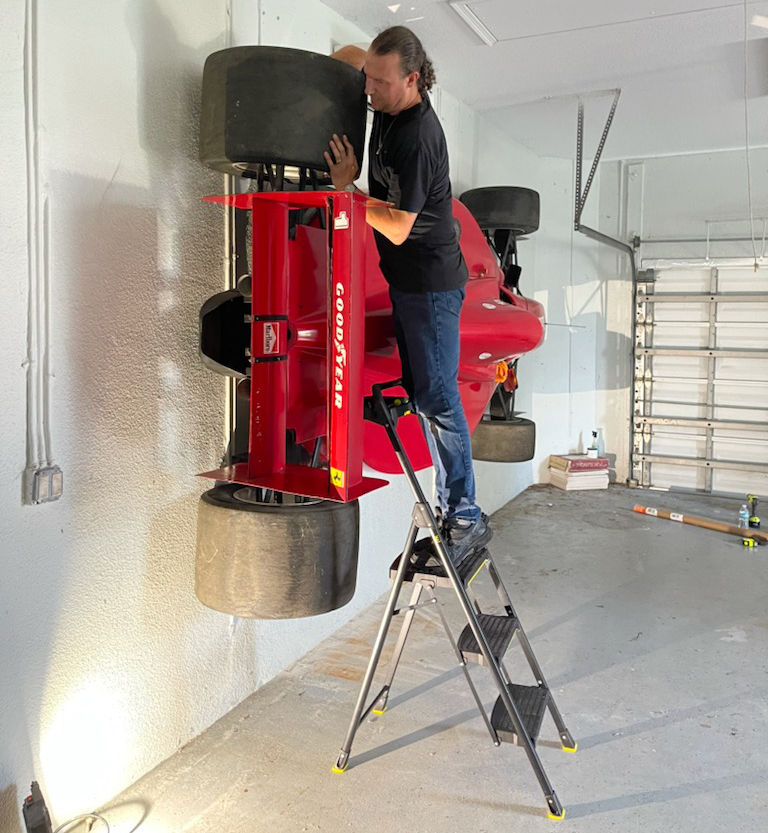 Jason adds wheel to Formula 1 Ferrari car body installation